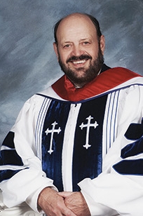 Dr. Babcock in gown.