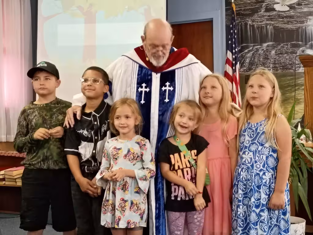 Dr. Babcock and kids at church.